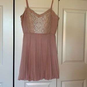 This is a light pink flowy mini dress. It also has padding on the inside.
